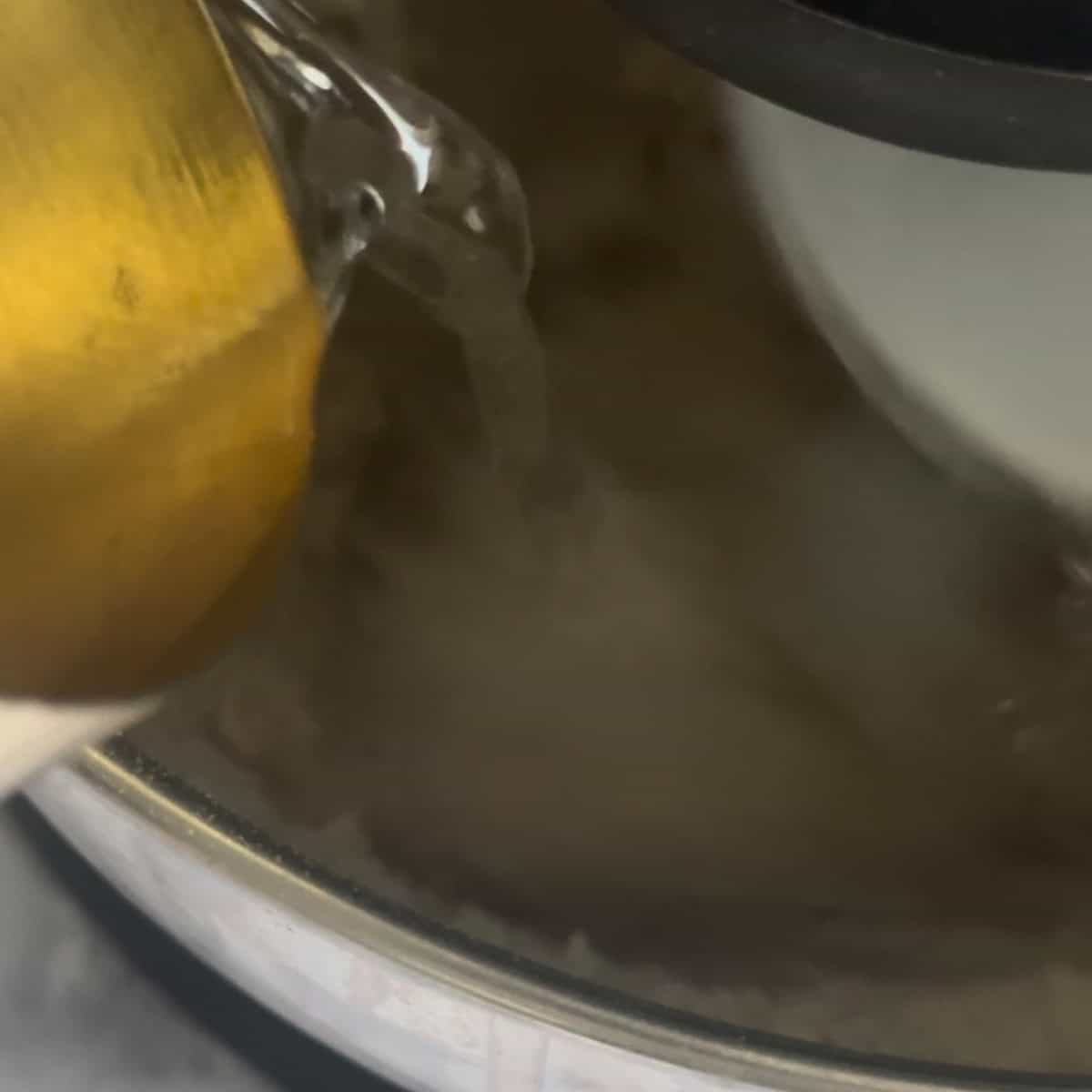 Water being added to stand mixer