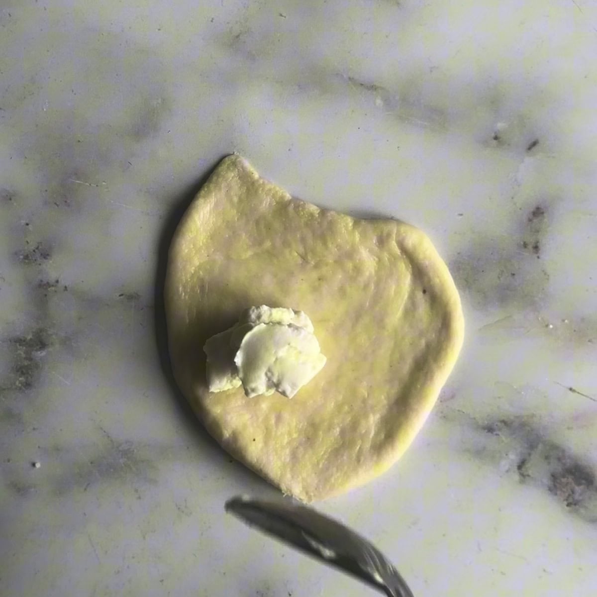 Cream Cheese in centre of piece of dough
