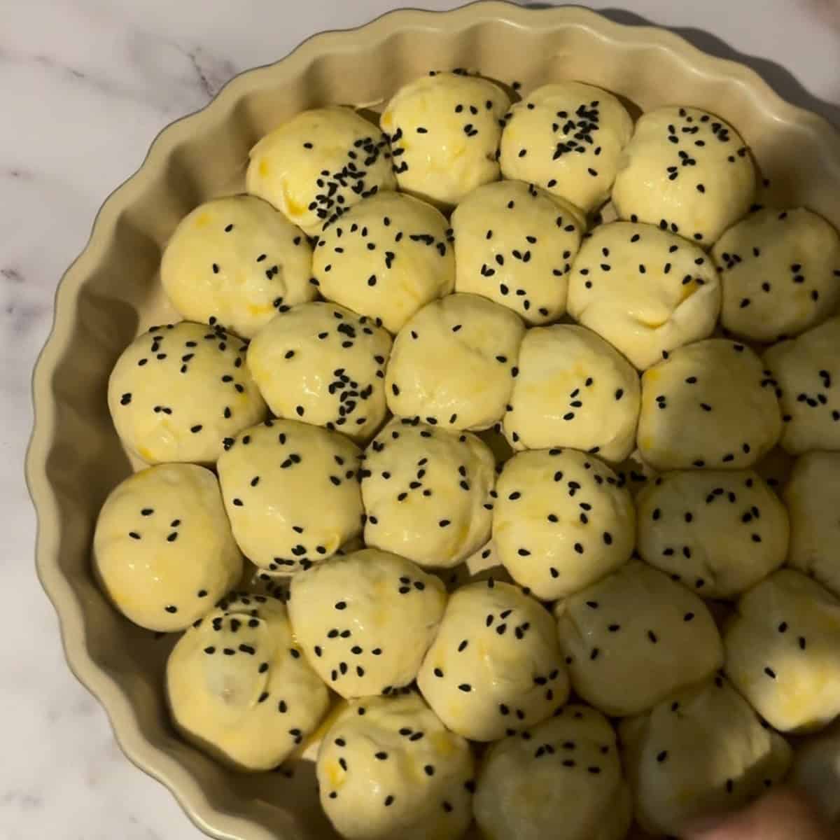 Sesame seeds added to buns