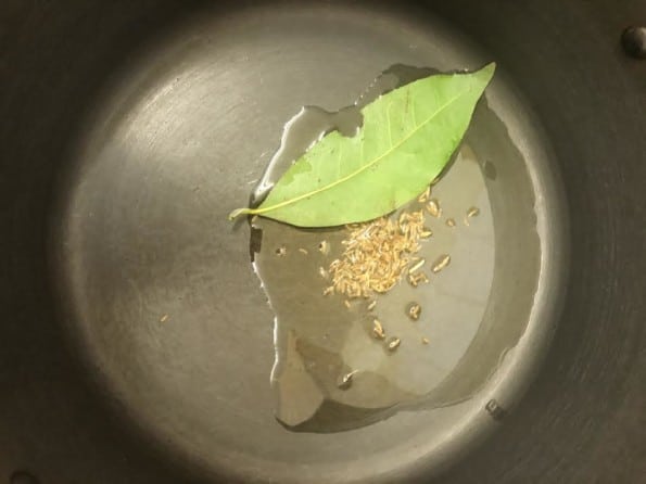 Bay leaves and Cumin Seeds in pot with oil