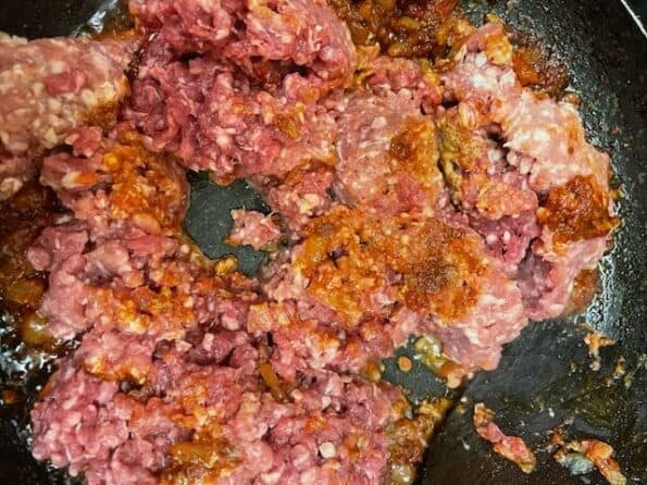 Lamb mince added to pan