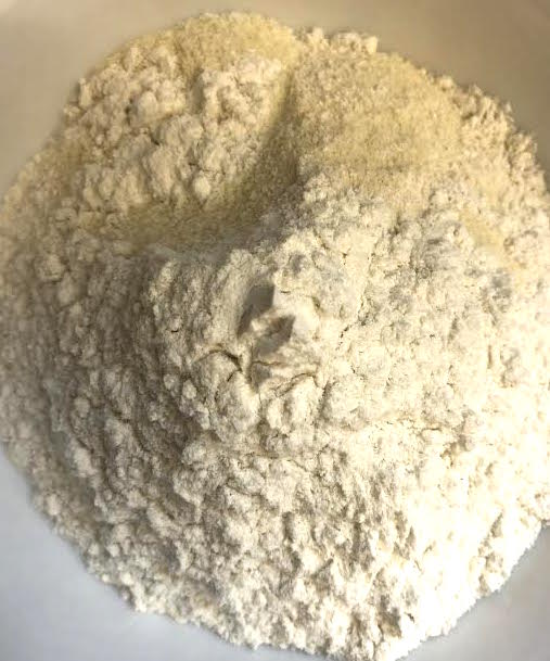 Semolina, Plain flour, Baking Powder and salt in bowl
