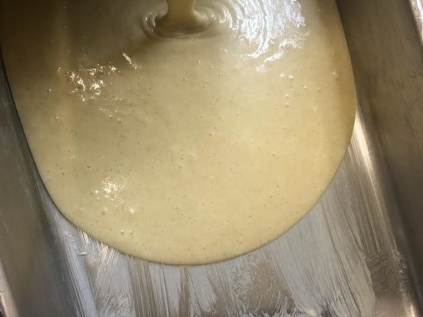 Cake batter being poured into tin