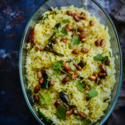 Lemon Rice in dish topped with fried peanuts and coriander