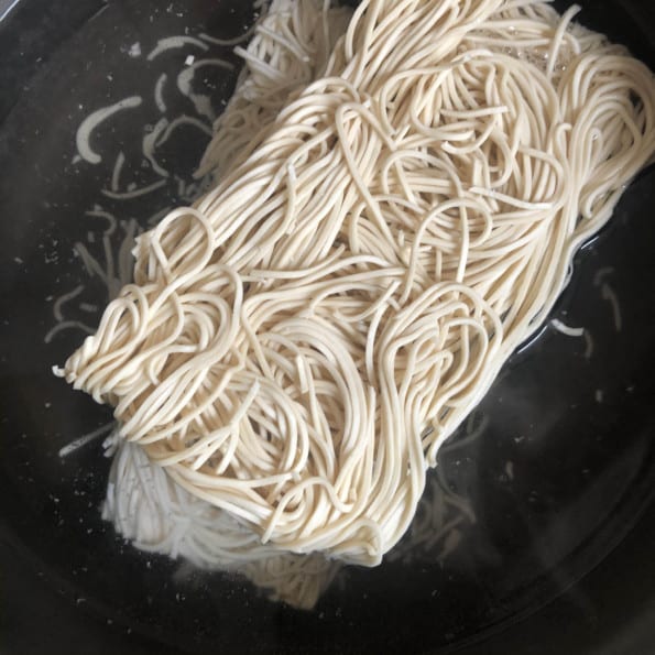 Noodles in simmering water
