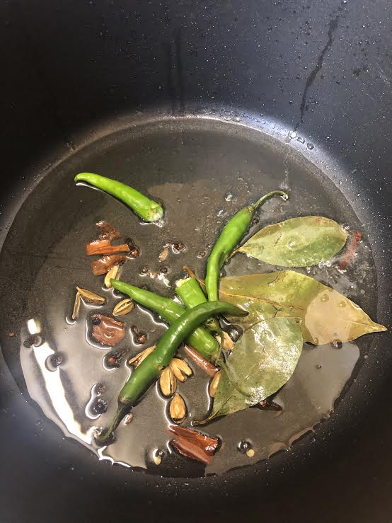 Add whole spices and green chilli to hot oil
