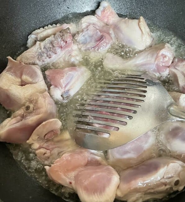 Chicken cooking in oil