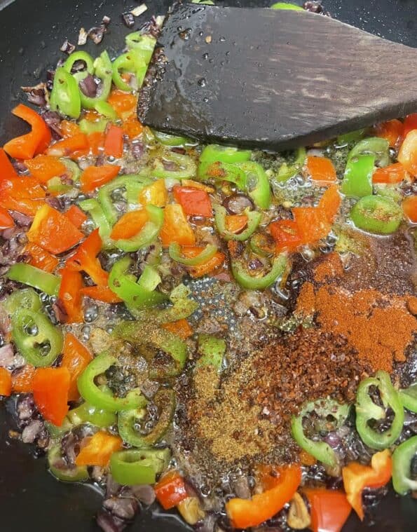 Spices added to Vegetables in pan