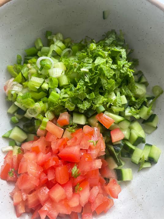 Chopped Mint added to salad bowl