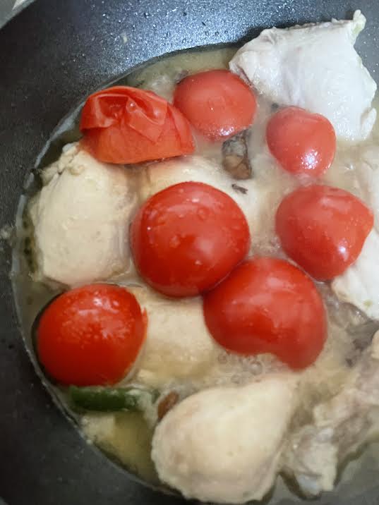 Tomato skin lefted off tomatoes in wok