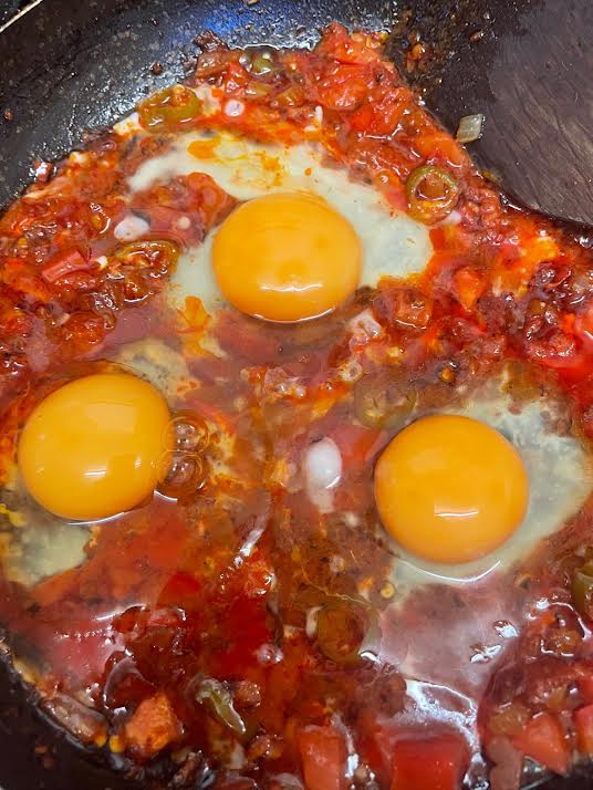 Eggs added to pan