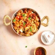 Menemen in dish with cheese and chilli to side