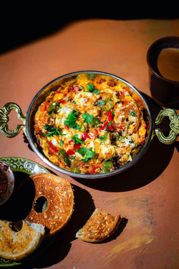 Menemen in dish with bagel to side