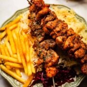 Shish with chips and rice in plate