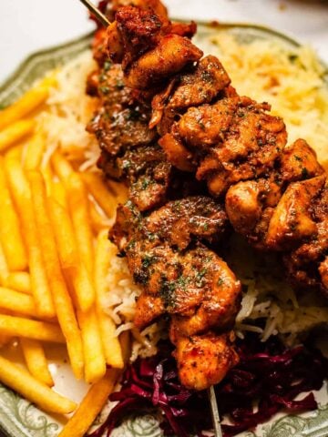 Shish with chips and rice in plate