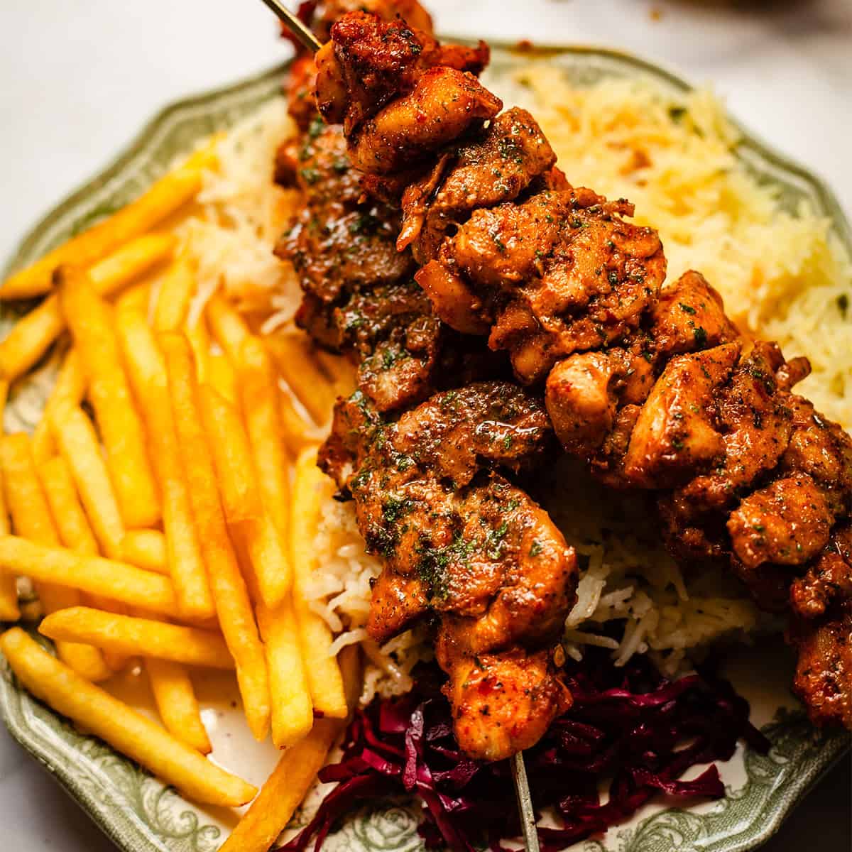 Tavuk Sis - Turkish Chicken Shish Kebab Shish with chips and rice in plate