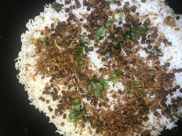 Fried onions added on rice layer