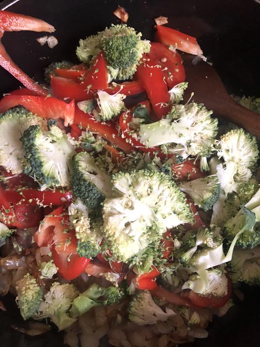 Red pepper and broccoli added to pot