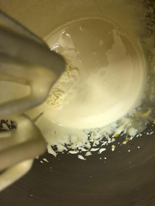 Egg yolks whisked in bowl of stand mixer