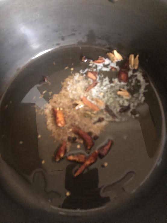 Whole spices frying in oil