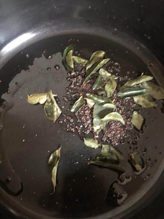 Curry Leaves and Mustard Seeds in oil in pan