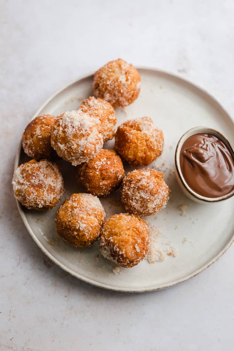 Donuts without yeast on a plate with chocolate sauce in small bowl