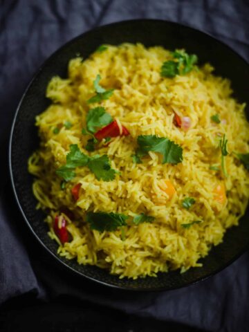 Peri rice in a bowl sprinkled with Coriander