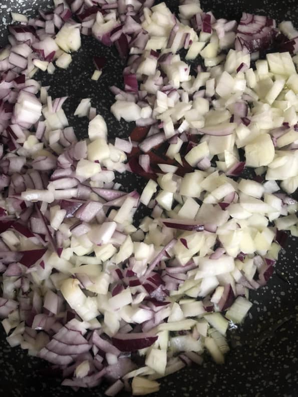 Diced Onions in pan with ghee/oil