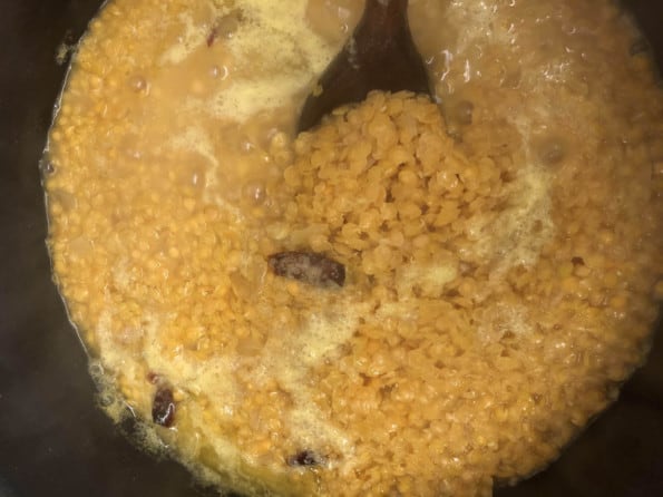 Red lentils in pot mid cooking