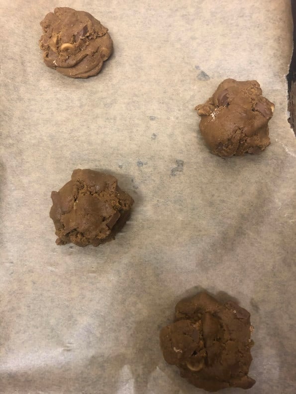 4 Cookie dough spaced out on baking tray 