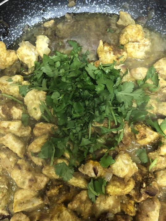 Cooked Chicken and coriander in pan