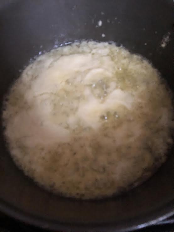 Onion paste cooking in pan