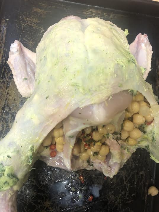 Roast chicken with tarragon butter under skin and chickpeas in cavity 
