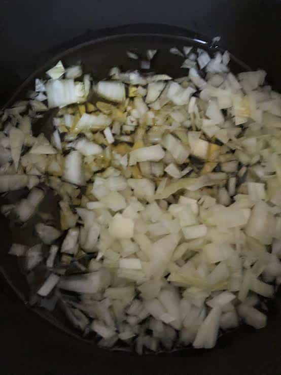Onions, Oil and Ghee in a dark pot