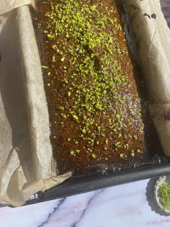 Baked Cake in tin with Pistachios on top