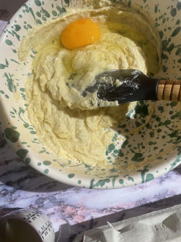 Egg added to bowl 