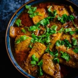 Fish Masala in bowl with Coriander on top