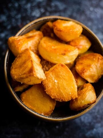 Crunchy roast potatoes in a bowl