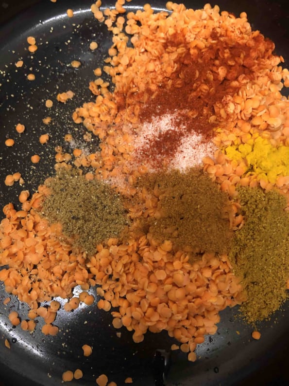 Red lentils and spices in pot