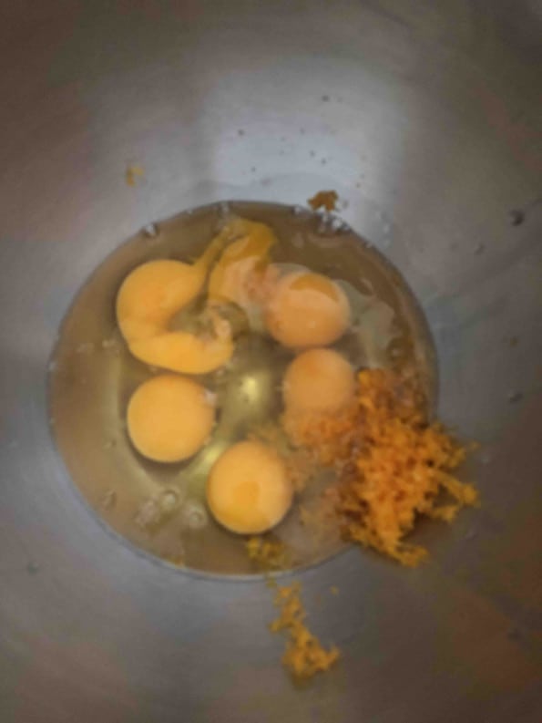 Orange Zest, Oil and Eggs in bowl 