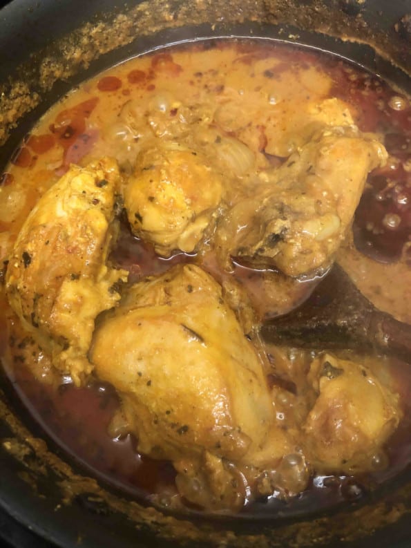Cooked chicken showing oil separating at top