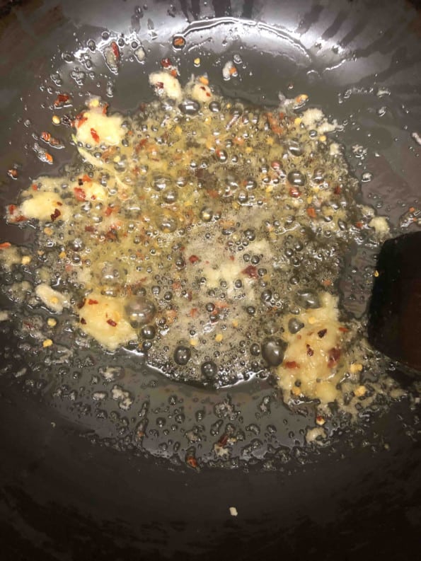Ginger, Garlic and Chilli flakes in oil in a wok