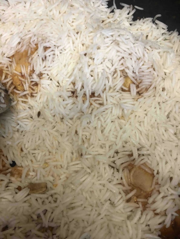 Rice added to Curry layer in pot
