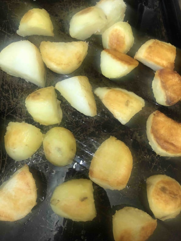 Golden Potatoes being flipped midway