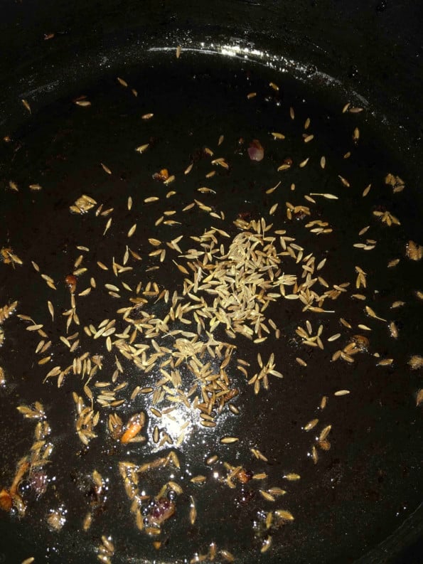 Cumin added to oil in pan