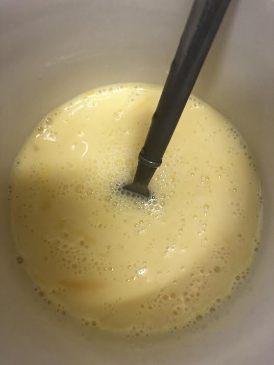 Eggs and milk whisked together in bowl