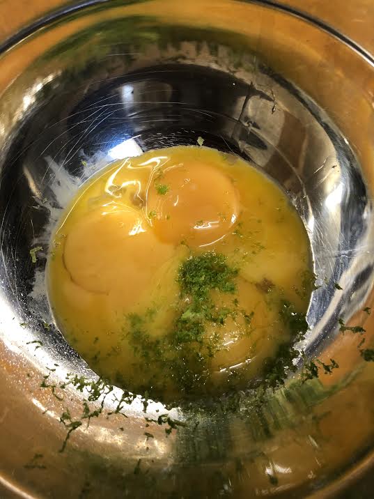 Egg yolk and zest in a bowl