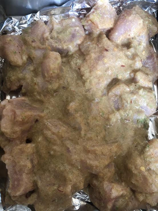Marinaded Chicken on a foil lined tray