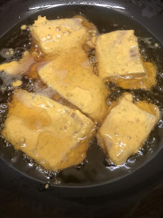 Fish in oil being fried