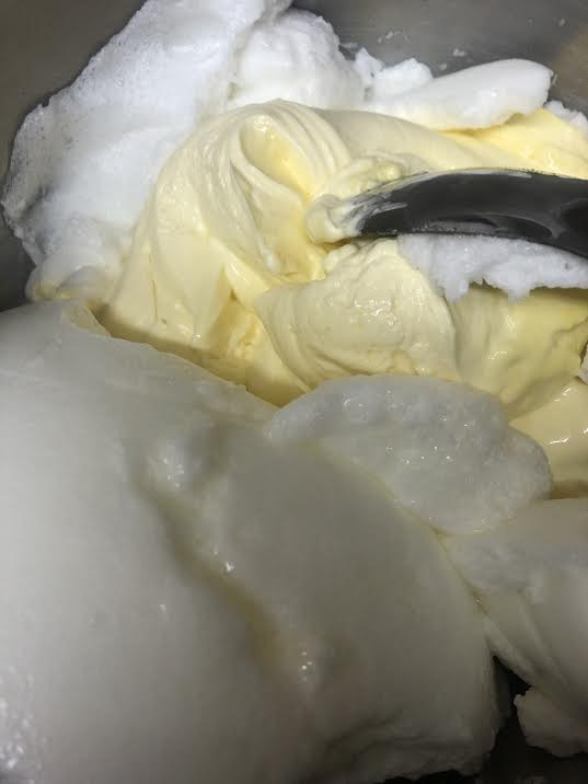 Egg whites being folded into mascarpone cream mixture